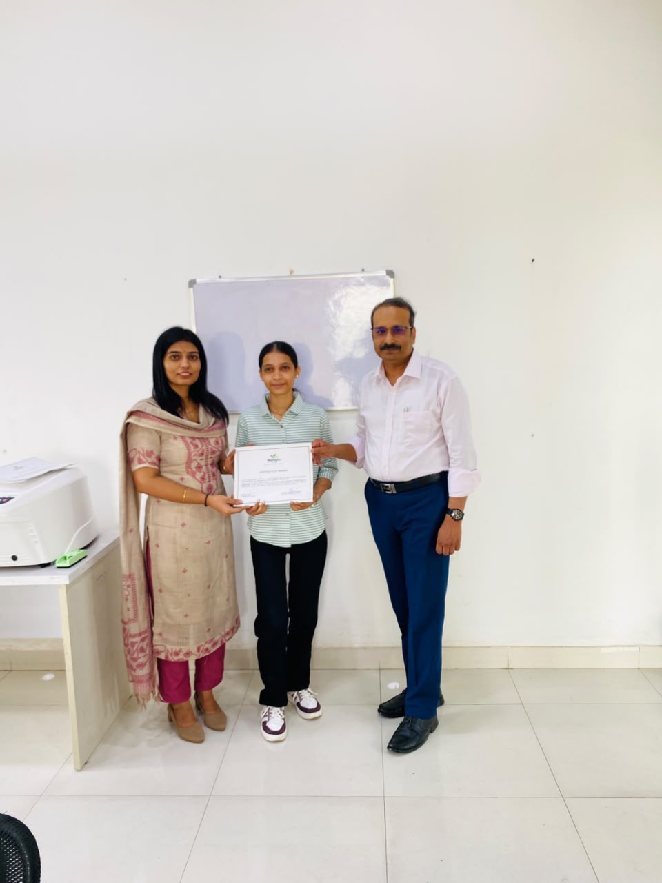 Trainee receiving certificate of training